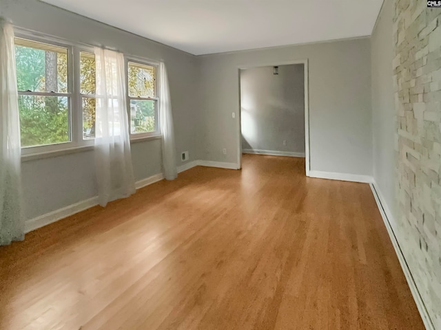 spare room with hardwood / wood-style flooring