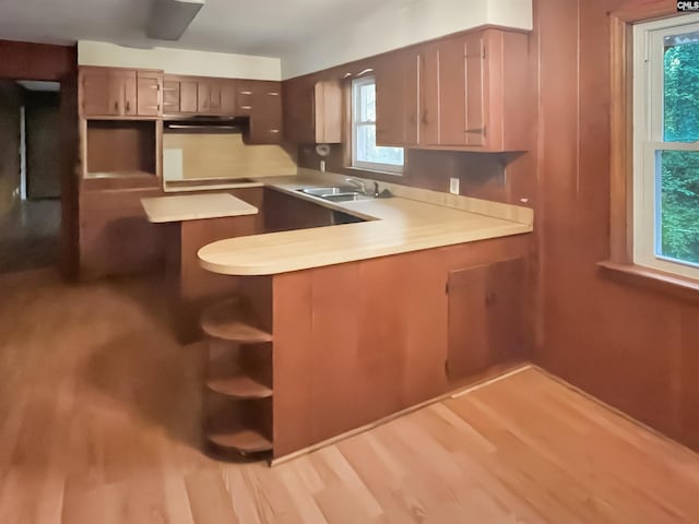 4650 Crystal Dr, Columbia, SC 29206 - kitchen featuring a sink, light wood-style floors, and light countertops
