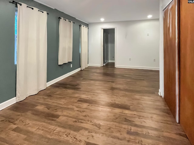 spare room with dark wood-type flooring