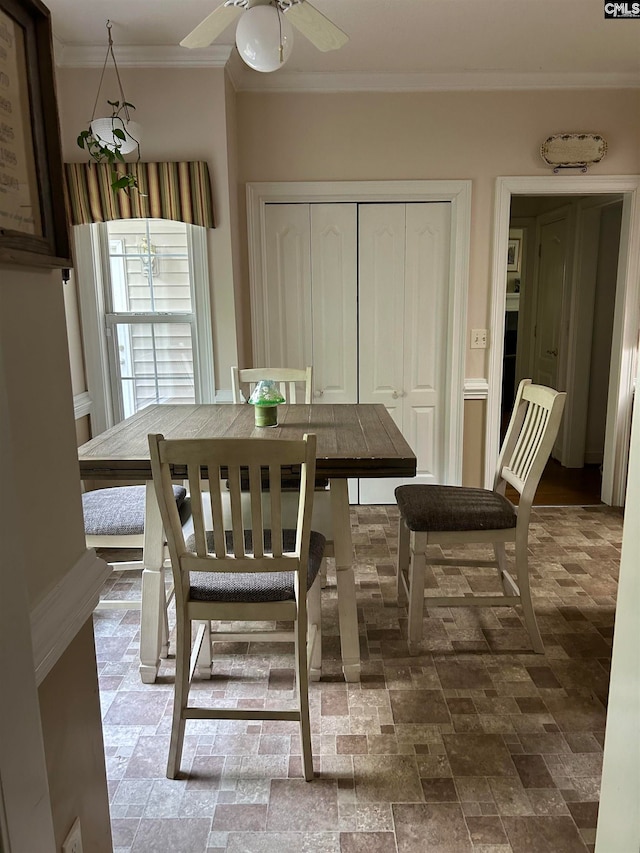 dining room featuring ceiling fan and ornamental molding