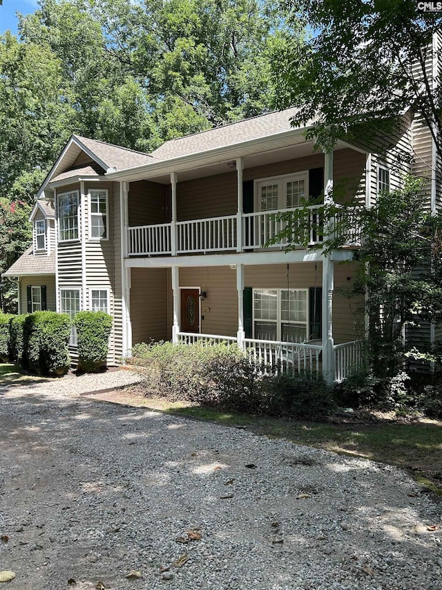 1110 Eleazer Rd, Irmo, SC 29063 - view of front of house with a balcony, covered porch, and roof with shingles