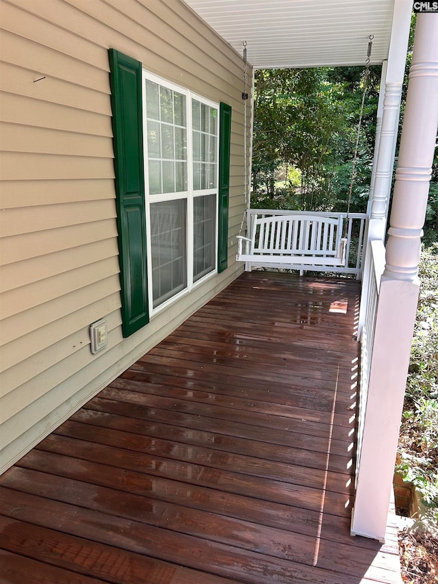 wooden terrace with a porch