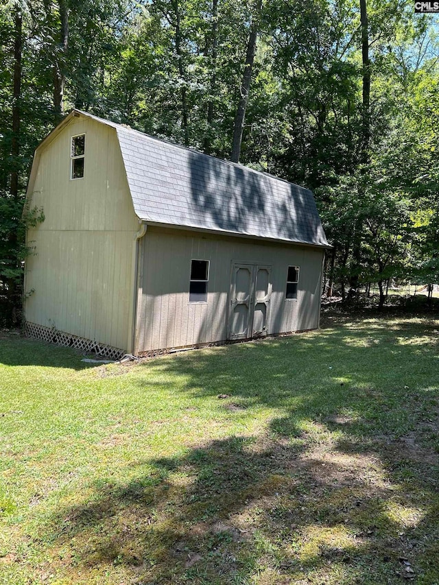 view of outbuilding with a lawn