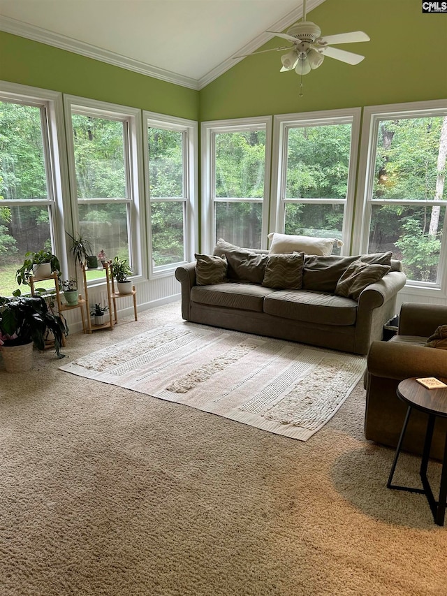 sunroom featuring ceiling fan, a wealth of natural light, and vaulted ceiling