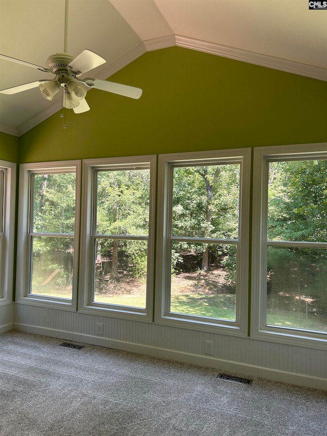 unfurnished sunroom with vaulted ceiling and ceiling fan