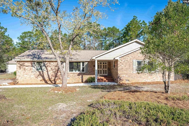 ranch-style home with a front lawn