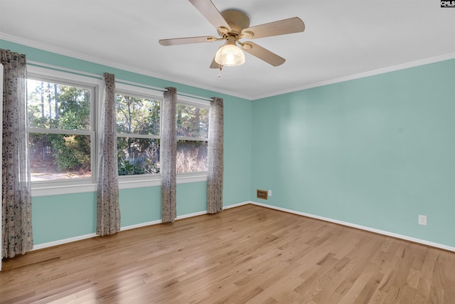 spare room featuring ceiling fan, light hardwood / wood-style floors, and crown molding