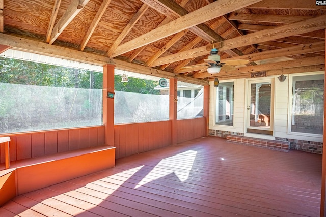 unfurnished sunroom featuring vaulted ceiling and ceiling fan