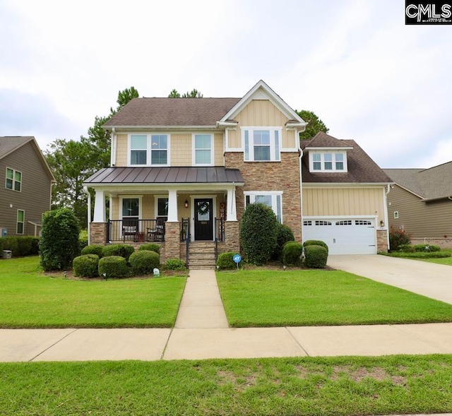 craftsman-style house featuring a porch and a front yard