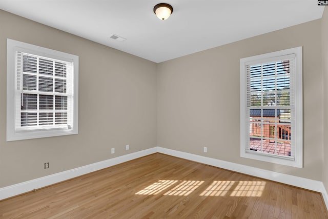 spare room featuring hardwood / wood-style flooring