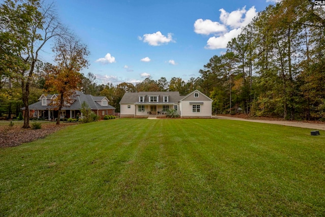 cape cod house with a front lawn and a porch