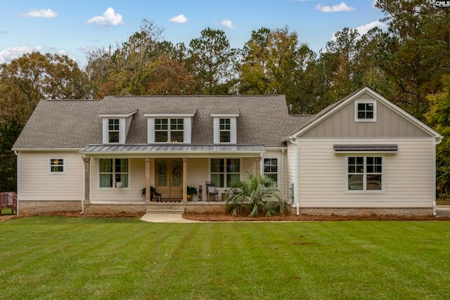 back of property featuring a yard and a porch