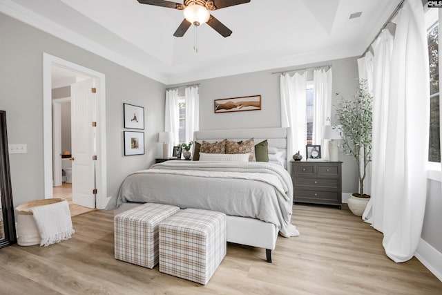 bedroom with light hardwood / wood-style floors and ceiling fan