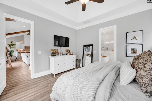 bedroom featuring ensuite bathroom, light hardwood / wood-style flooring, and ceiling fan