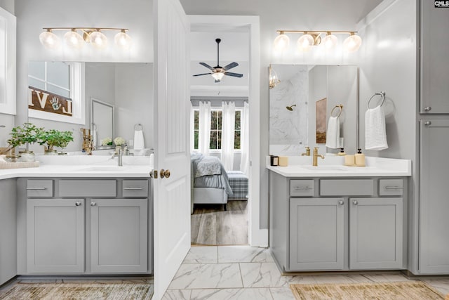 bathroom featuring ceiling fan and vanity