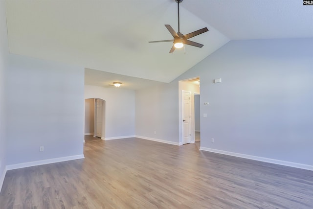 unfurnished room with ceiling fan, wood-type flooring, and vaulted ceiling