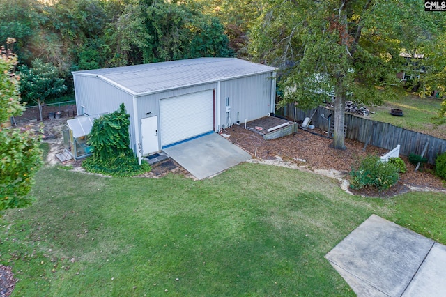 exterior space featuring a garage and a yard