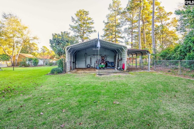 view of outdoor structure featuring a carport and a yard