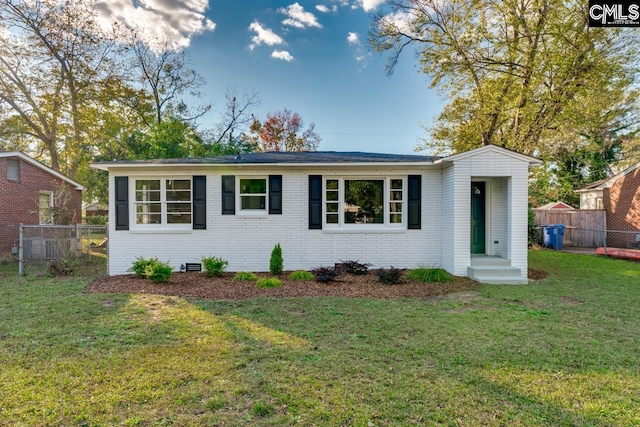 ranch-style house with a front lawn