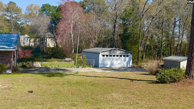 garage featuring a yard