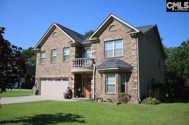 view of front of home with a balcony, a garage, and a front lawn