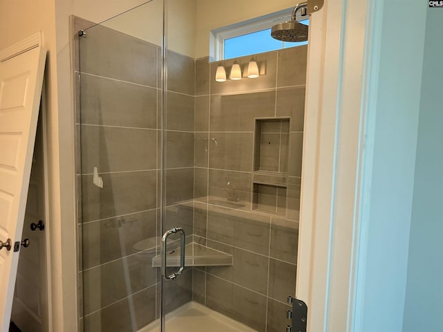 bathroom featuring an enclosed shower