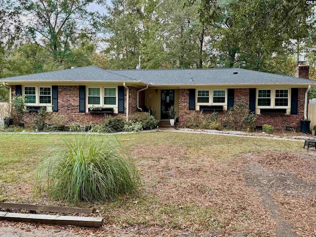 single story home featuring a front yard