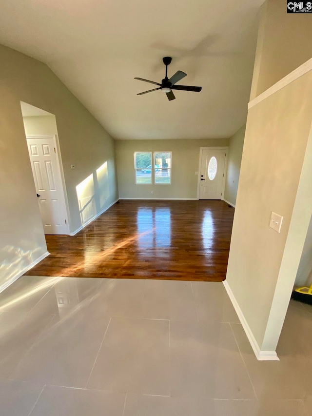 unfurnished living room with wood-type flooring, ceiling fan, and lofted ceiling