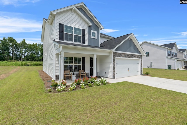 craftsman house with a porch, a garage, and a front lawn