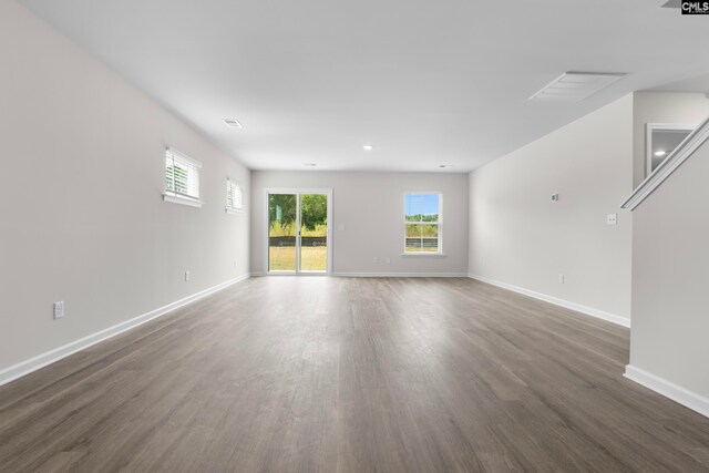 unfurnished room featuring dark wood-type flooring