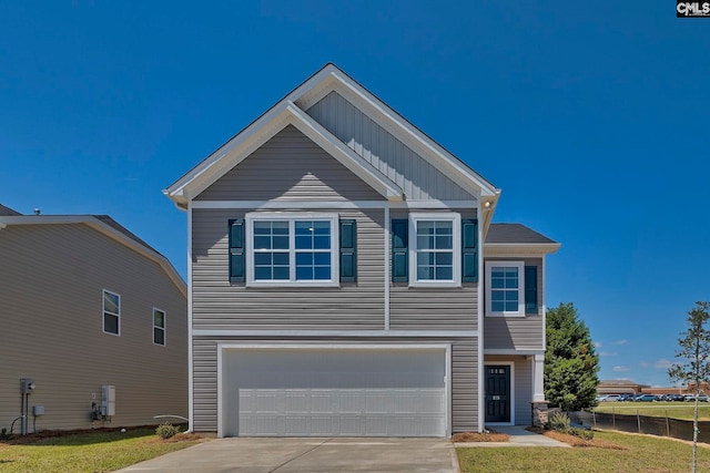 view of front facade with a garage and a front lawn