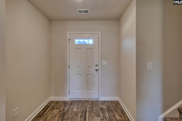 doorway with dark wood-type flooring