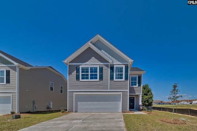 view of front facade featuring a garage and a front lawn