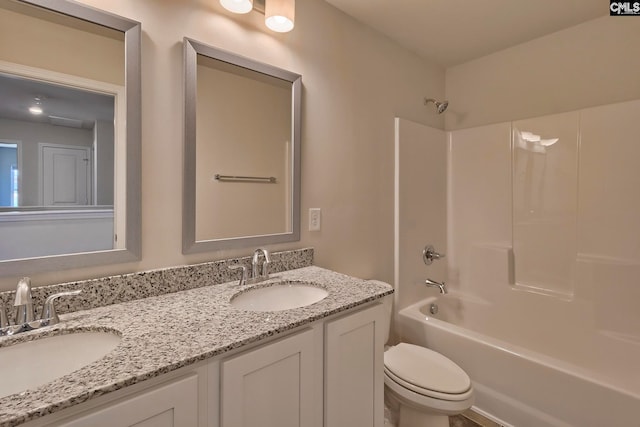 full bathroom with vanity, shower / bath combination, and toilet