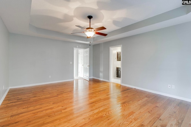 spare room featuring ceiling fan and light wood-type flooring