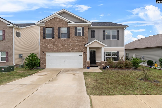 view of front of house with a garage and a front lawn