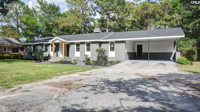 ranch-style house featuring a front lawn and a carport