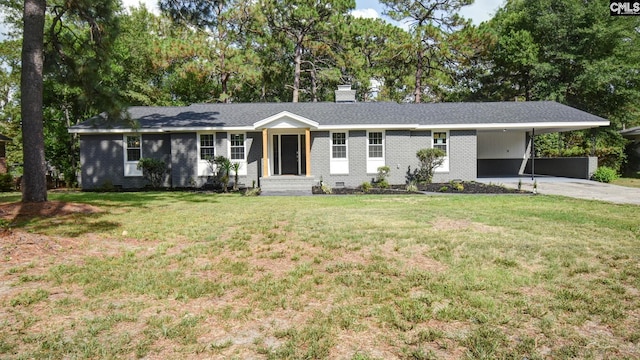 ranch-style house featuring a front yard and a carport