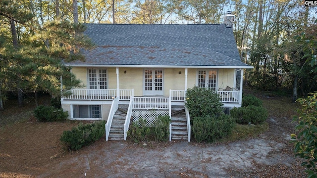 view of front of property featuring french doors and a porch