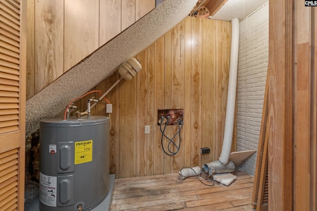 utility room with electric water heater