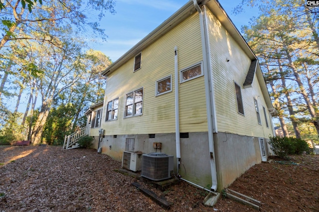 view of property exterior with central AC unit