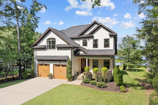 craftsman-style home featuring a porch, a garage, and a front lawn