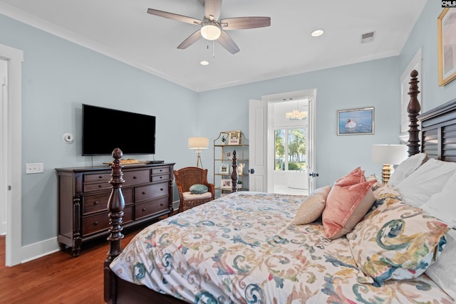 bedroom featuring hardwood / wood-style floors, ceiling fan, and ornamental molding