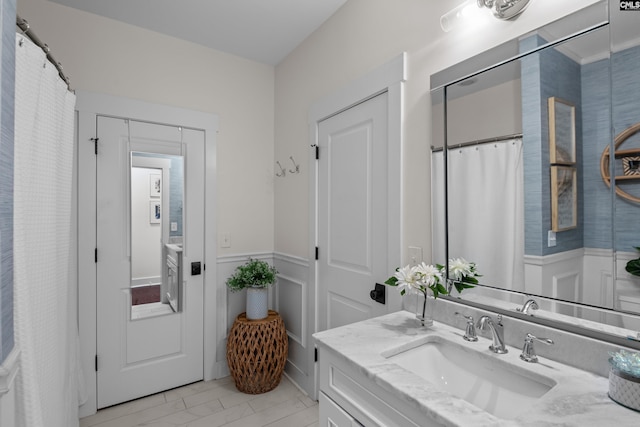 bathroom with tile patterned flooring and vanity