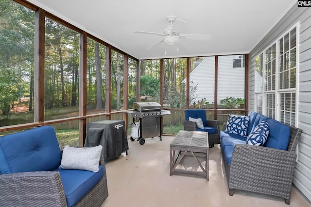 sunroom featuring ceiling fan and a healthy amount of sunlight