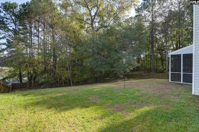 view of yard featuring a sunroom