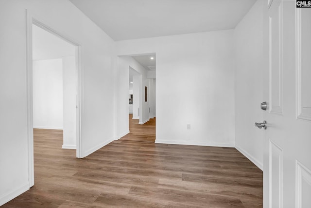 unfurnished room with hardwood / wood-style flooring