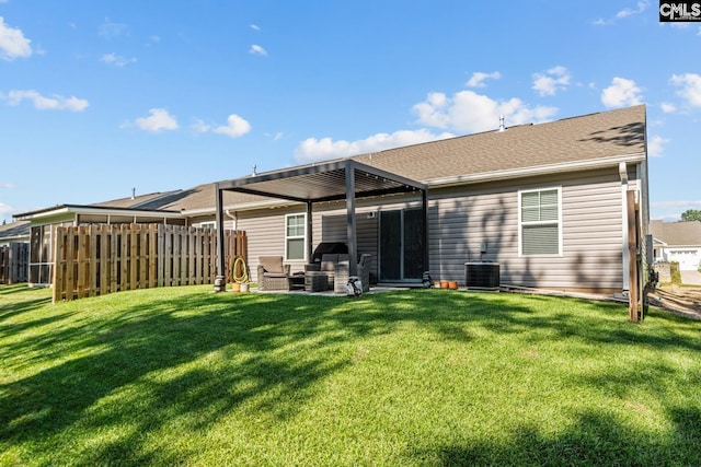 back of house with a yard, central AC, and a patio area