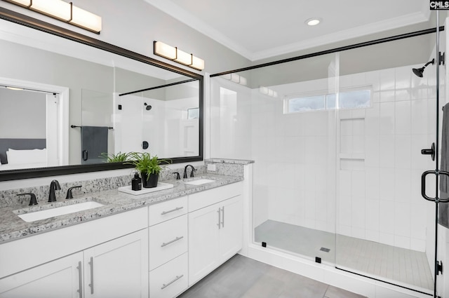 bathroom with tile patterned flooring, vanity, an enclosed shower, and ornamental molding