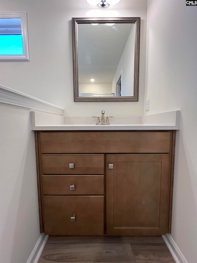 bathroom featuring vanity and wood-type flooring